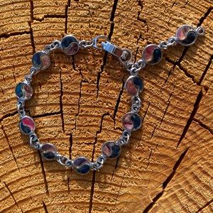 Yin-yang silver and shell charm bracelet